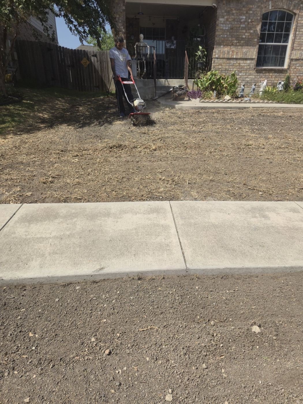 Tilling compacted soil to prepare for new sod